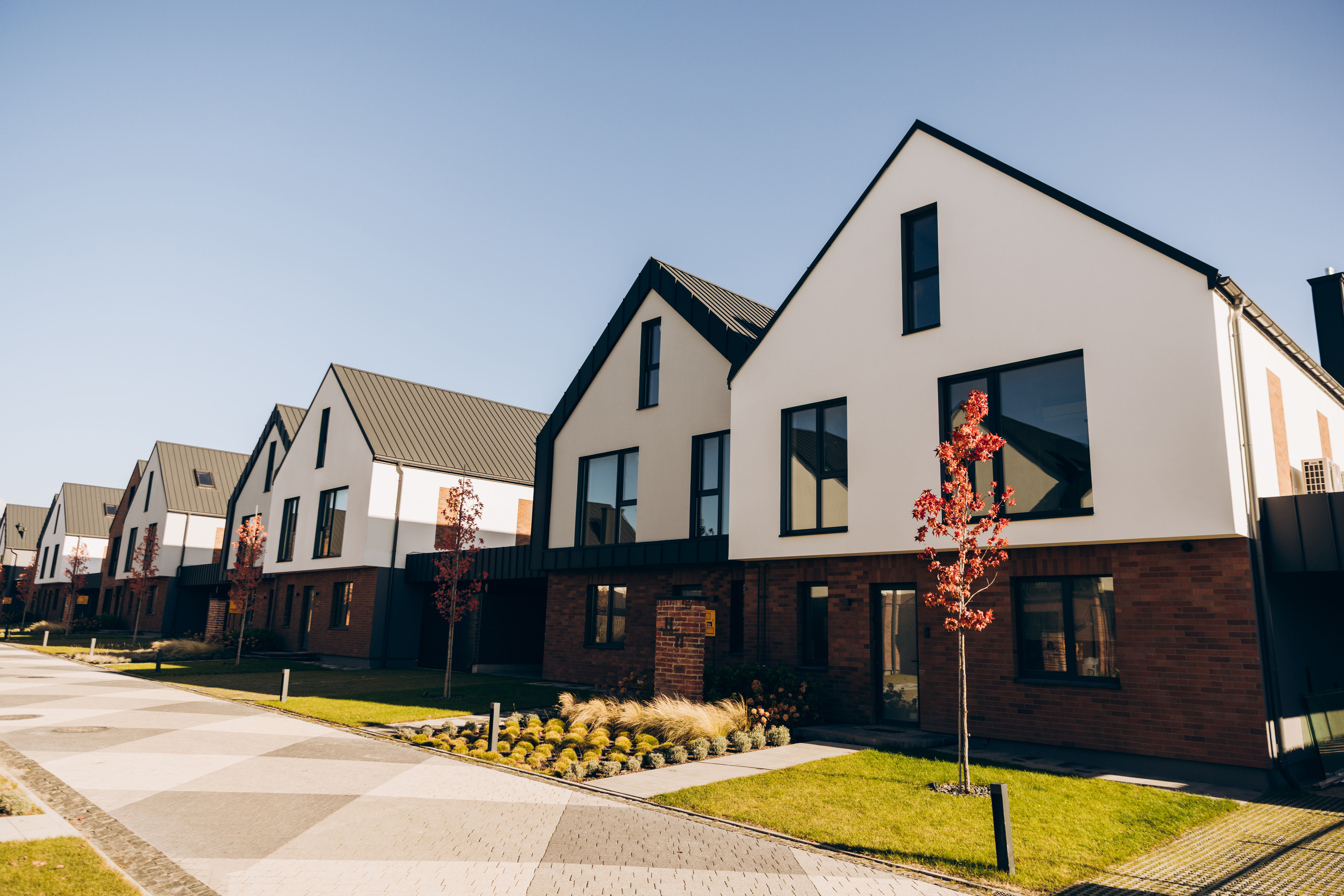 A row of modern completed homes — placeholder photography.